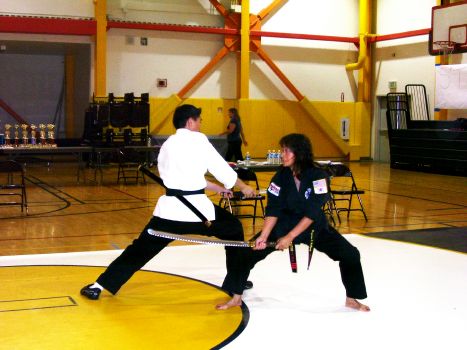 Inst. Virginia Rallo Jay finishes her opponent